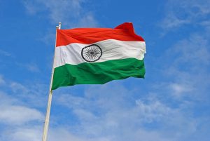 Indian flag waving in blue sky